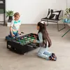 Two children are playing foosball in a room. Anteprima dell’immagine prodotto