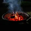 Sausages are being grilled on a charcoal grill at night, with smoke rising from the coals. Náhľad obrázku produktu
