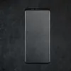 A smartphone screen protector is shown against a dark, textured background. Produktbild-Vorschau