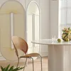 A dining table and chair set in a well-lit room with decorative screens. Produktbild-Vorschau