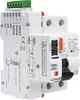 A close-up, angled view of a white electrical device with green and orange accents, mounted on a DIN rail. Produktbild-Vorschau