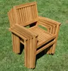 Stack of wooden chairs on grass. Produktbild-Vorschau