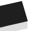 A close-up view of the corner of a white cabinet with a black top surface. Anteprima dell’immagine prodotto