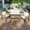 A patio set with a loveseat, two chairs, and a coffee table on a wooden deck, with a garden and waterfall in the background. Anteprima dell’immagine prodotto