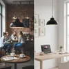 A split image showing a cafe scene on the left and a home office setup on the right, both featuring a black pendant light. Produktbild-Vorschau