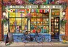 A charming bookshop facade with flags and flowers, a bicycle parked outside. Anteprima dell’immagine prodotto