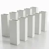 A group of white ceramic vases arranged in rows on a white surface. Produktbild-Vorschau