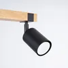 A close-up shot of a black spotlight attached to a wooden beam. Podgląd zdjęcia produktu