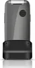 A close-up, studio shot of the back of a flip phone and its charging dock, presented on a white background. Podgląd zdjęcia produktu
