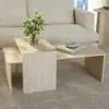 A living room setting with a sofa and a set of nesting coffee tables. Produktbild-Vorschau