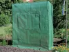 A green greenhouse-like structure covered by a tarp, situated outdoors in a garden setting with trees and flowers. Náhled obrázku produktu