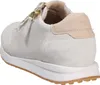 A side view of a beige sneaker. Produktbild-Vorschau
