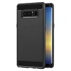 A black phone case with a brushed metal texture is shown on a white background. A smartphone is partially visible inside the case. Produktbild-Vorschau