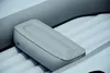 A close-up view of an inflatable boat's internal structure, showing a grey cushioned seat resting on white ribbed air chambers. Anteprima dell’immagine prodotto