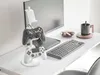 A gaming setup with controllers, a keyboard, and a monitor. Produktbild-Vorschau