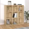 A wooden bookshelf with several compartments, some of which are decorated with books and decorative items. Produktbild-Vorschau