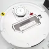 Top-down view of a white robot vacuum cleaner. Voir les images du produit