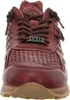 A close-up, front-facing view of a red leather sneaker. Voir les images du produit