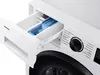 Close-up view of the detergent drawer and control panel of a white Samsung washing machine. Produktbild-Vorschau