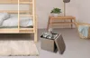 A bedroom scene with a bunk bed, a storage ottoman, and a laundry basket. Produktbild-Vorschau
