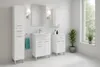 A clean, modern bathroom with white tile walls and floor, featuring white bathroom furniture including a tall cabinet, a vanity with a sink, and a wall-mounted cabinet. A large window with greenery outside is visible on the right. Produktbild-Vorschau
