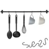 A black metal kitchen rail with various utensils and mugs hanging from it. Náhled obrázku produktu