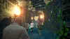 People running through a stone corridor with torches and vines. Produktbild-Vorschau