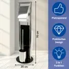 A freestanding toilet paper holder and toilet brush set with a chrome finish and black accents, shown in a bathroom setting with a light wooden floor and a white wall. Produktbild-Vorschau