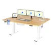 A clean studio shot of an adjustable standing desk with multiple monitors, a laptop, and accessories. Podgląd zdjęcia produktu