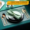 A table setting with plates, napkins, and cutlery. Produktbild-Vorschau