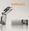 Two chrome-plated shower door hinges are displayed on a reflective white surface against a plain background. The text 'Raffiniert' is visible in orange at the top right. Produktbild-Vorschau