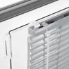 Close-up view of a window blind mechanism and mounting bracket. Produktbild-Vorschau
