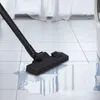A vacuum cleaner head is shown on a tiled floor, sucking up a puddle of water. Anteprima dell’immagine prodotto