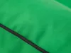 A close-up view of green fabric with a black trim. Produktbild-Vorschau