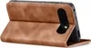 A brown flip case for a smartphone is shown standing upright, revealing the phone's camera module. Produktbild-Vorschau