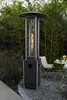 A patio heater is shown in an outdoor setting with bamboo in the background and a table and chair to the side. Produktbild-Vorschau