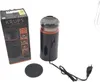 A coffee grinder and its packaging are displayed on a white background. Náhled obrázku produktu