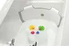 A baby bathtub insert with rubber ducks floating in the water. Produktbild-Vorschau