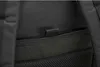 A close-up view of the black fabric and mesh material of a backpack. Anteprima dell’immagine prodotto