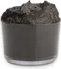 A black, viscous substance in a clear glass container. Produktbild-Vorschau