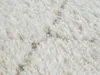 Close-up view of a shaggy rug with a diamond pattern. Produktbild-Vorschau