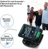 A family on a beach with a blood pressure monitor in the foreground. Anteprima dell’immagine prodotto