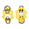 A pair of yellow ice cleats for shoes, shown against a white background. Produktbild-Vorschau