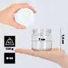 A hand holds a white lid above a glass jar, while another hand supports the jar from below. Dimensions and weight information are displayed in graphic icons. Podgląd zdjęcia produktu