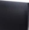 A close-up view of a black wooden surface with visible grain. Podgląd zdjęcia produktu
