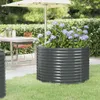 A raised garden bed filled with hydrangeas sits on a patio next to a table and chairs. Voir les images du produit