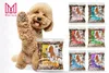 A dog posing with multiple bags of dog treats. Produktbild-Vorschau