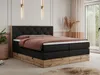 A bedroom scene featuring a large boxspring bed. Produktbild-Vorschau
