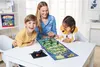 A family playing a board game at a table. Voir les images du produit