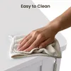 A hand is wiping a white surface with a cloth, with text overlay indicating 'Easy to Clean'. Produktbild-Vorschau